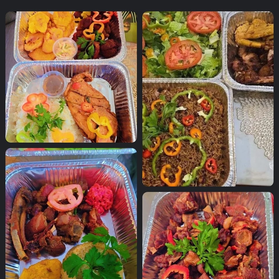 Haitian takeout trays display griyo, fried plantains, rice, salad, vegetables, and assorted meats garnished with peppers and herbs.